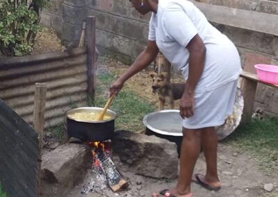 Wife Paulette cooking Caribbean soup in compound where we're based in Nakuru